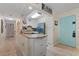 Kitchen with white cabinets, granite countertops, and stainless steel appliances at 1415 Ocean Shore Blvd # B030, Ormond Beach, FL 32176