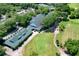 Aerial view of community clubhouse, green space and golf course at 3404 Rexford Cir, Ormond Beach, FL 32174