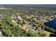 Aerial view showing a home near a lake in a secluded community at 3404 Rexford Cir, Ormond Beach, FL 32174