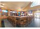 L-shaped bar with barstools and TVs at 3404 Rexford Cir, Ormond Beach, FL 32174