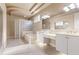 Elegant bathroom with double sinks, a soaking tub, and glass block shower at 3404 Rexford Cir, Ormond Beach, FL 32174