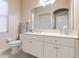 Bathroom with white cabinets, a large mirror, and a shower/tub combo at 3404 Rexford Cir, Ormond Beach, FL 32174