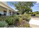 Landscaped clubhouse with porch and golf carts at 3404 Rexford Cir, Ormond Beach, FL 32174