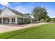 View of the clubhouse with landscaping at 3404 Rexford Cir, Ormond Beach, FL 32174