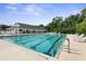 Resort-style community pool with lounge chairs and clubhouse at 3404 Rexford Cir, Ormond Beach, FL 32174
