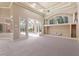 Spacious Gathering room with pool view and built-in shelving at 3404 Rexford Cir, Ormond Beach, FL 32174