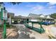 Additional golf cart storage, bag drop, and clubhouse exterior at 3404 Rexford Cir, Ormond Beach, FL 32174