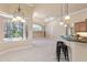 Kitchen with breakfast bar seating and view into Gathering room at 3404 Rexford Cir, Ormond Beach, FL 32174