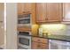 Built-in double oven and microwave in a light wood kitchen at 3404 Rexford Cir, Ormond Beach, FL 32174