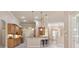 Well-equipped kitchen with light wood cabinets and breakfast bar at 3404 Rexford Cir, Ormond Beach, FL 32174