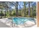 Inviting screened pool with spa and lush landscaping at 3404 Rexford Cir, Ormond Beach, FL 32174