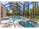 Inviting pool and spa with screened enclosure, perfect for relaxation and outdoor enjoyment at 3404 Rexford Cir, Ormond Beach, FL 32174