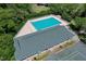 Resort-style pool and tennis courts surrounded by lush landscaping at 3404 Rexford Cir, Ormond Beach, FL 32174