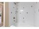 Clean shower with white tile and decorative accents at 3404 Rexford Cir, Ormond Beach, FL 32174