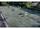 Aerial view of well-maintained tennis courts with seating at 3404 Rexford Cir, Ormond Beach, FL 32174