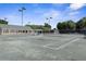 Tennis courts with lighting for nighttime play at 3404 Rexford Cir, Ormond Beach, FL 32174