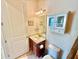 Bathroom with single vanity, toilet and a medicine cabinet at 708 Aldenham Ln, Ormond Beach, FL 32174