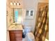 Bathroom with single vanity, toilet and shower/tub combo at 708 Aldenham Ln, Ormond Beach, FL 32174