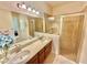 Large bathroom with double vanity and walk in shower at 708 Aldenham Ln, Ormond Beach, FL 32174
