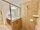 Bathroom with double vanity, large shower, and tile flooring at 708 Aldenham Ln, Ormond Beach, FL 32174