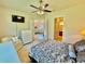Bedroom with ensuite bathroom and views into living room at 708 Aldenham Ln, Ormond Beach, FL 32174