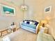 Comfortable guest bedroom with a daybed and plenty of pillows at 708 Aldenham Ln, Ormond Beach, FL 32174