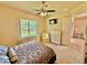 Spacious bedroom with a dresser and backyard views at 708 Aldenham Ln, Ormond Beach, FL 32174