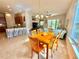 Light-filled dining area adjacent to kitchen and living room at 708 Aldenham Ln, Ormond Beach, FL 32174