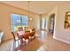 Casual dining space with table and chairs near entryway at 708 Aldenham Ln, Ormond Beach, FL 32174