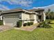 Well-maintained single-story home with attached garage and landscaped yard at 708 Aldenham Ln, Ormond Beach, FL 32174
