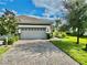 Villa home with driveway and beautifully landscaped yard at 708 Aldenham Ln, Ormond Beach, FL 32174