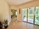 Guest bedroom with private access to a backyard patio at 708 Aldenham Ln, Ormond Beach, FL 32174