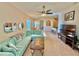 Spacious living room featuring a large sectional sofa and flat-screen TV at 708 Aldenham Ln, Ormond Beach, FL 32174