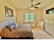 Main bedroom with large window and ensuite bathroom access at 708 Aldenham Ln, Ormond Beach, FL 32174