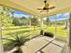Screened porch overlooking a lush green backyard at 708 Aldenham Ln, Ormond Beach, FL 32174