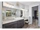 Elegant bathroom with double vanity, large mirror, and a soaking tub at 660 Aldenham Ln, Ormond Beach, FL 32174