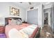 Charming bedroom with a double bed and gray closet doors at 660 Aldenham Ln, Ormond Beach, FL 32174