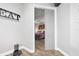 Bright bedroom with hardwood floors and a view into the bedroom from the hallway at 660 Aldenham Ln, Ormond Beach, FL 32174