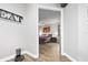 Bright bedroom with hardwood floors and a view into the bedroom from the hallway at 660 Aldenham Ln, Ormond Beach, FL 32174
