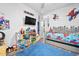 ' bedroom with a twin bed, superhero wall decor, and toy storage at 660 Aldenham Ln, Ormond Beach, FL 32174