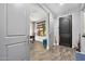 Bright entryway with barn doors and wood flooring at 660 Aldenham Ln, Ormond Beach, FL 32174