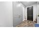 Modern entryway with barn doors and wood-look tile at 660 Aldenham Ln, Ormond Beach, FL 32174