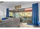 Gathering room with sliding glass doors leading to a lanai and pool at 660 Aldenham Ln, Ormond Beach, FL 32174