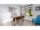 Modern home office with a desk, chair, and ample natural light at 660 Aldenham Ln, Ormond Beach, FL 32174