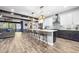 Modern kitchen with two-toned cabinetry, large island, and stainless steel appliances at 660 Aldenham Ln, Ormond Beach, FL 32174