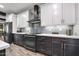 Modern kitchen with stainless steel appliances and gray cabinetry at 660 Aldenham Ln, Ormond Beach, FL 32174