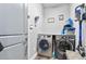 Laundry room with washer, dryer, and storage at 660 Aldenham Ln, Ormond Beach, FL 32174