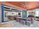 Covered patio with seating area, offering an extension of the living space at 660 Aldenham Ln, Ormond Beach, FL 32174