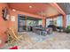 Relaxing patio with seating area and outdoor kitchen at 660 Aldenham Ln, Ormond Beach, FL 32174