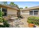 Charming courtyard with stone accents and seating area at 7 Jasmine Run, Ormond Beach, FL 32174